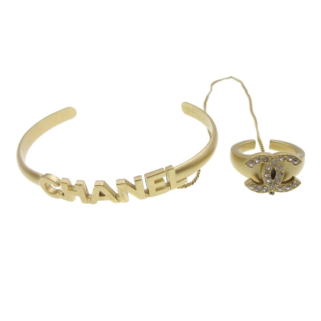 Chanel Gold Plated Rhinestone Bangle Bracelet 5.9 in: Chanel Gold Plated Rhinestone Bangle Bracelet 5.9 in Elevate your accessory collection with this stunning Chanel Rhinestone Bangle Chain Ring. Crafted from high-quality gold plated material, this brac