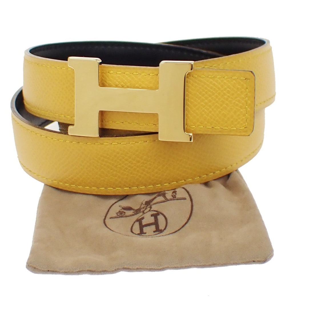 Reversible Yellow Leather Belt by Hermes Constance Model: Reversible Yellow Leather Belt by Hermes Constance Model Hermes Constance reversible belt crafted in yellow leather designed for women. This belt features a 3 cm wide strap and a buckle measuring 5 cm