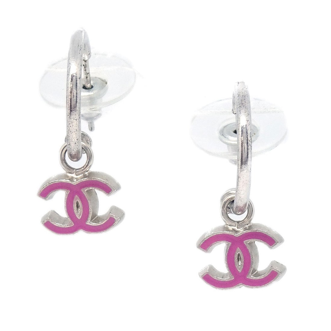Silver Tone CC Logo Dangle Earrings by Chanel 04P: Silver Tone CC Logo Dangle Earrings by Chanel 04P These Chanel dangle CC pierced earrings feature a classic silver-tone design with the iconic CC logo. Made from silver-plated material, they are desig