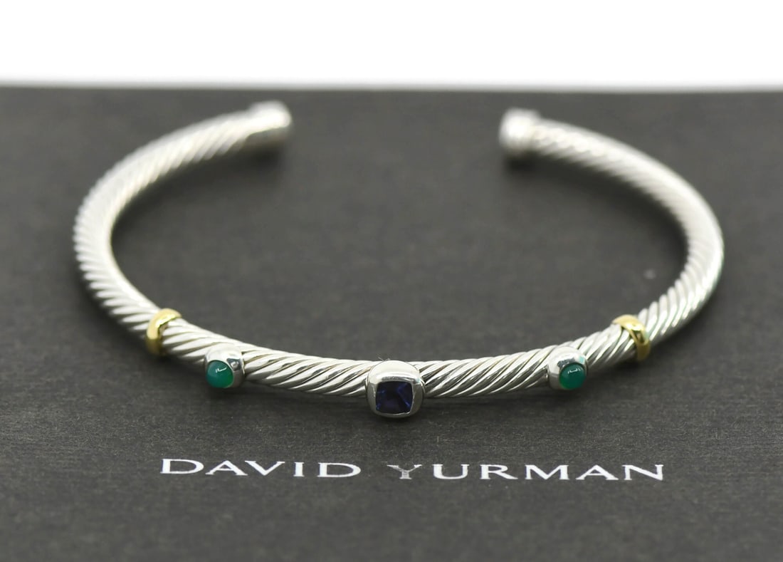 Amethyst Sterling Silver Cuff Bracelet by David Yurman: Amethyst Sterling Silver Cuff Bracelet by David Yurman This David Yurman cuff bracelet is crafted from sterling silver with a 925 purity. It features an amethyst as the main stone and is designed in t