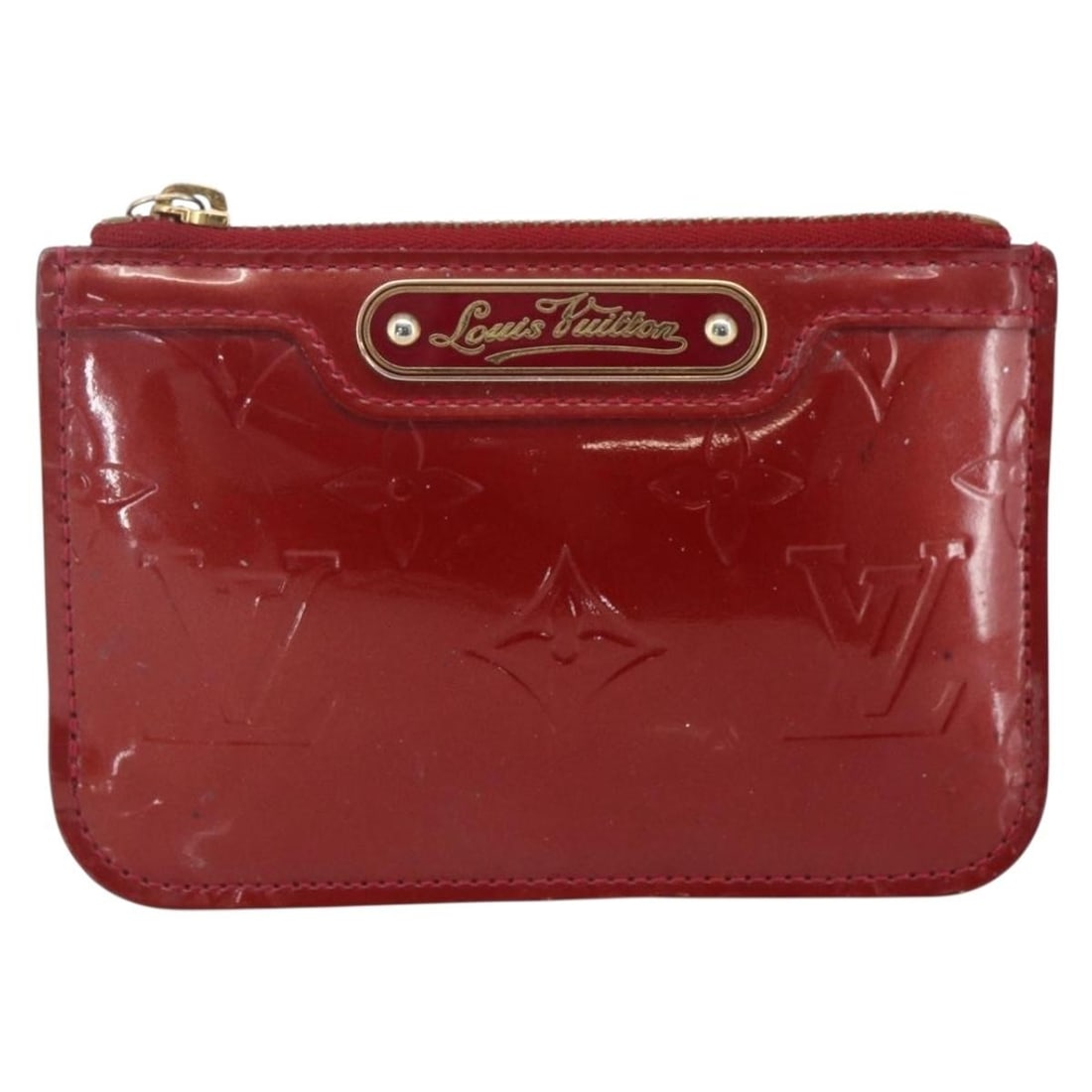 Louis Vuitton Monogram Vernis Red Pochette Cles NM Patent Leather: Louis Vuitton Monogram Vernis Red Pochette Cles NM Patent Leather This Louis Vuitton Pochette Cles NM is crafted from red Monogram Vernis patent leather. Designed for women, it features a compact size