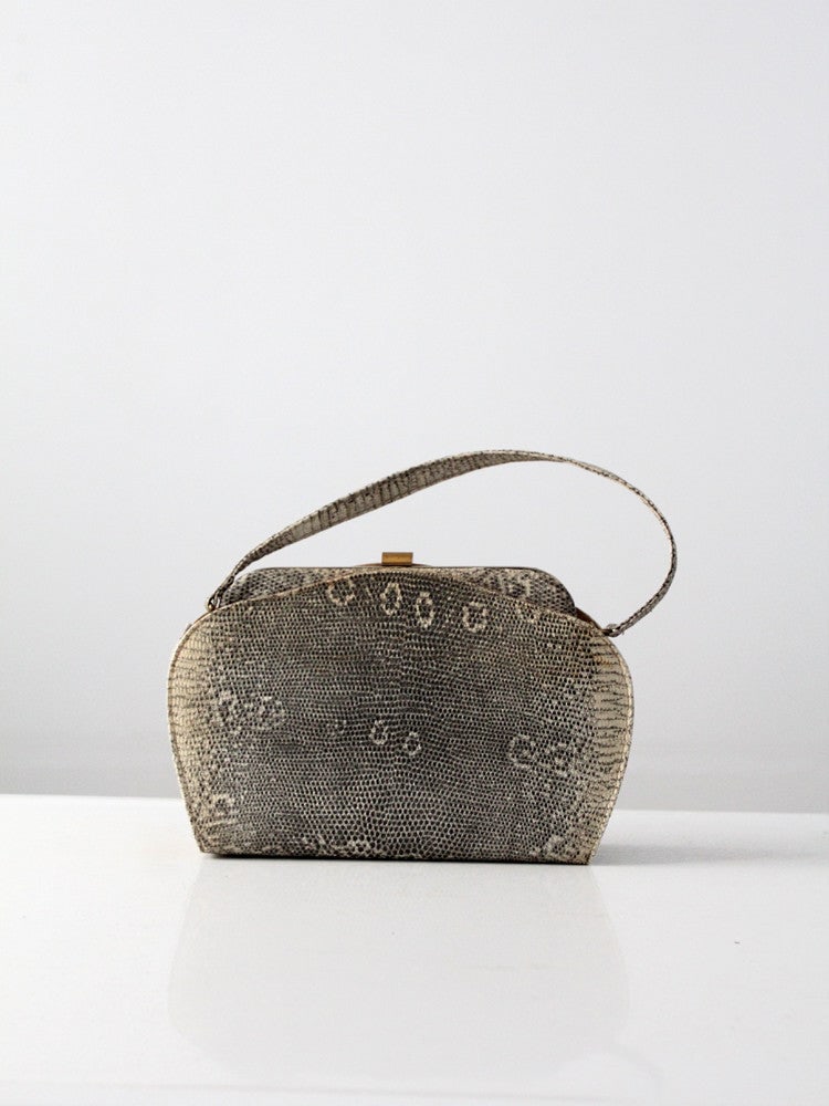 1940s Vintage Monitor Lizard Skin Handbag Gold Tone Frame: 1940s Vintage Monitor Lizard Skin Handbag Gold Tone Frame Discover this exquisite 1940s vintage monitor lizard skin handbag, a true statement piece from our Stylist's Collection. This chic purse featu