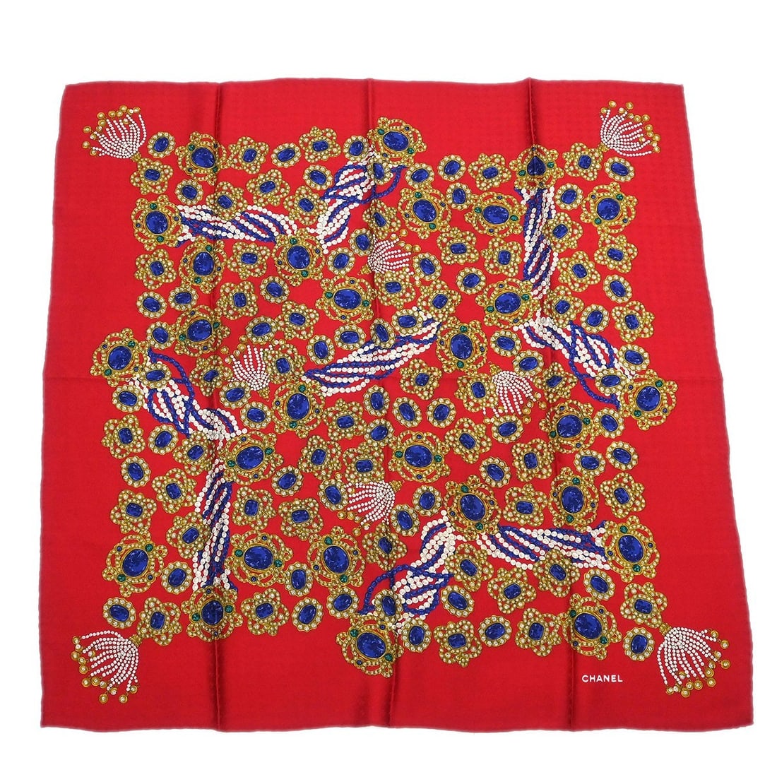 Red Silk Scarf by Chanel Italy Small Size Accessory: Red Silk Scarf by Chanel Italy Small Size Accessory This Chanel red scarf is crafted in Italy and features a stylish and vibrant design. The scarf is in very good condition, making it a chic accessory