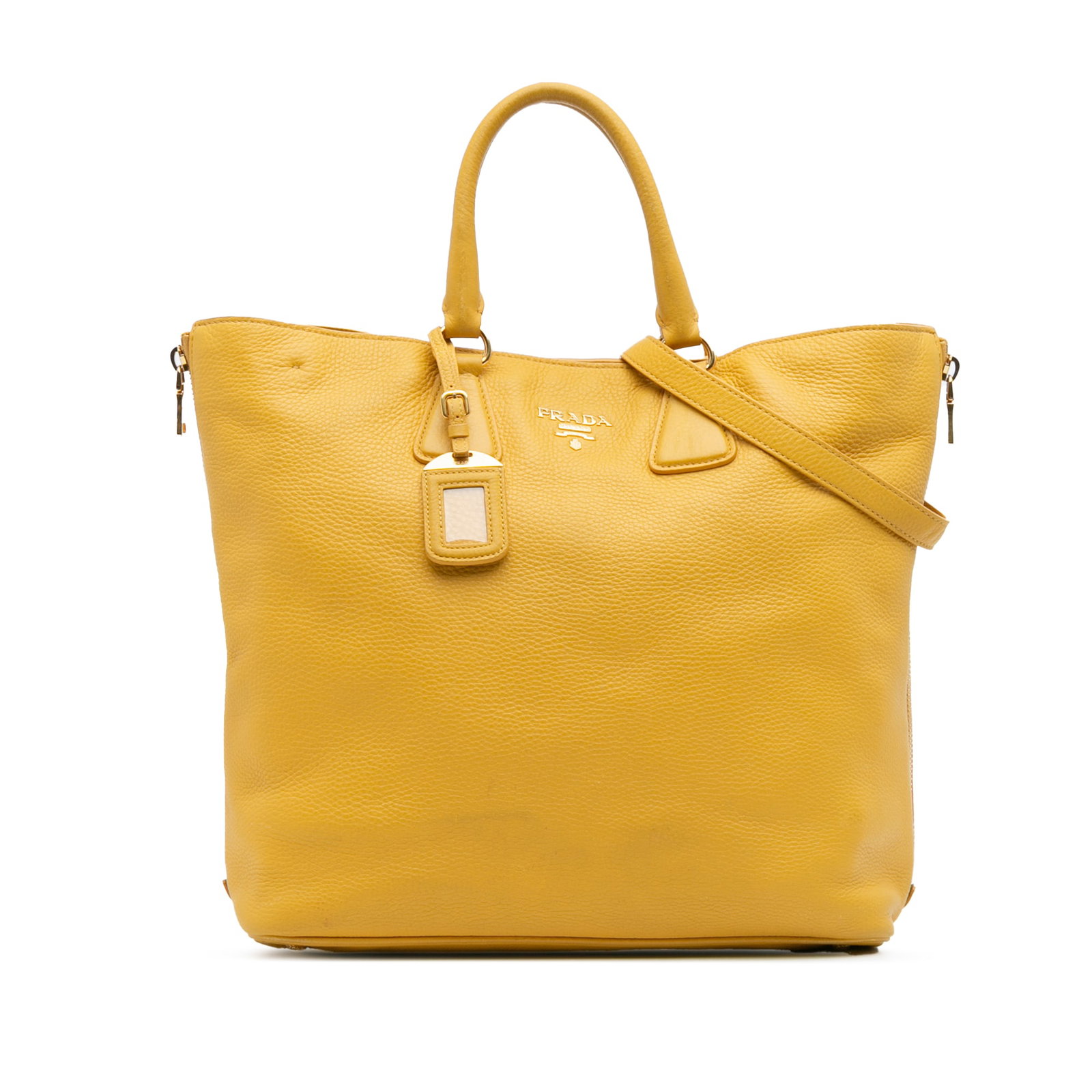 Prada Vitello Daino Convertible Tote Yellow Leather Bag: Prada Vitello Daino Convertible Tote Yellow Leather Bag The Prada Vitello Daino Side Zip Open Convertible Tote is a stylish and versatile bag crafted from premium leather. This tote features a unique