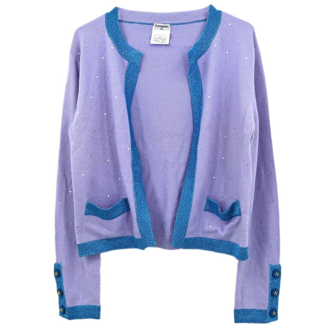 Chanel Vintage Purple Cashmere Cardigan with Logo Button 96A #42: Chanel Vintage Purple Cashmere Cardigan with Logo Button 96A #42 Elevate your casual wardrobe with this vintage Chanel cardigan, crafted from luxurious 100% cashmere. This beautiful purple knit piece