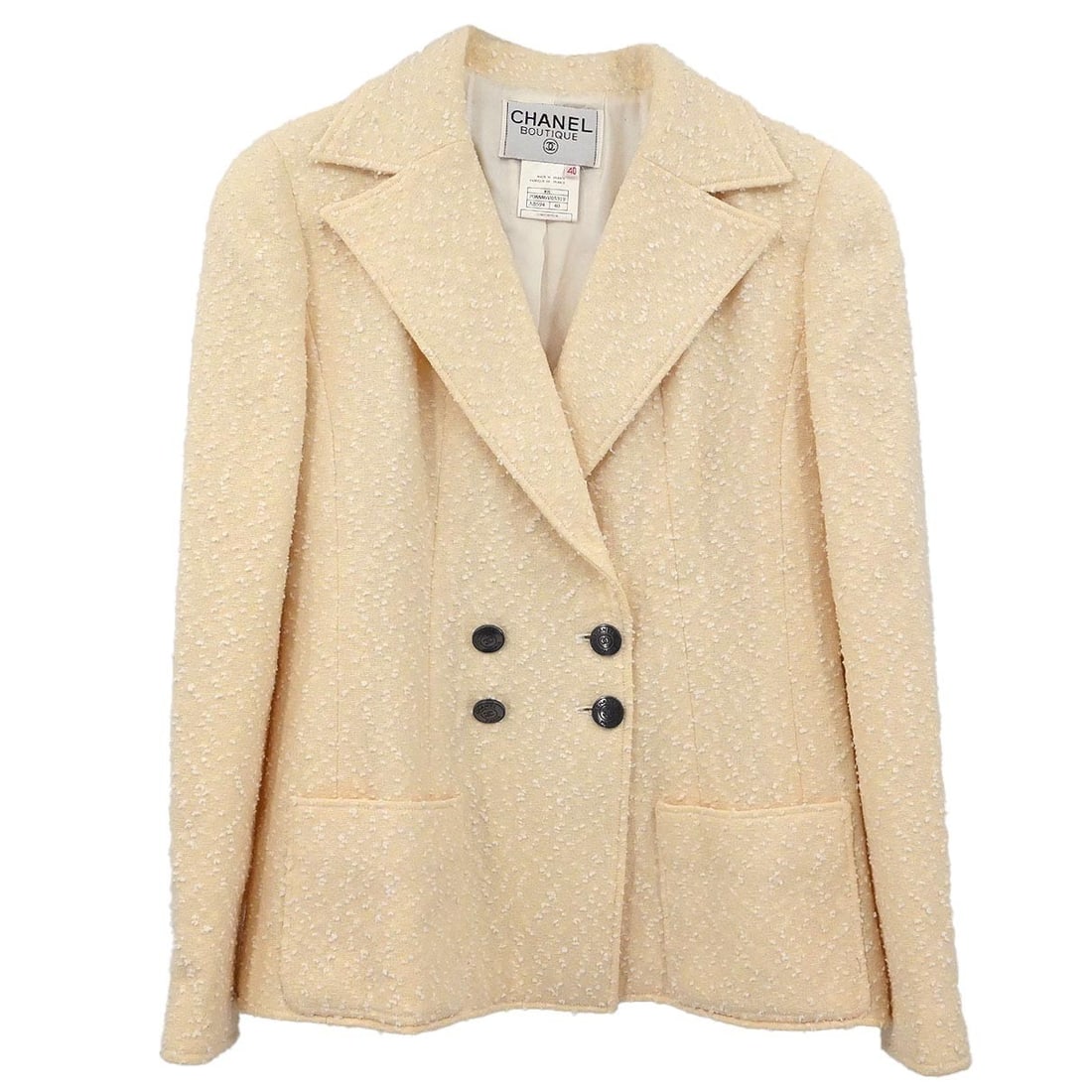 Off-White Wool Blend Collared Jacket by Chanel Size 40: Off-White Wool Blend Collared Jacket by Chanel Size 40 This Chanel double-breasted jacket in off-white features a mid-length silhouette crafted from a blend of 72% wool and 28% nylon. Designed with a