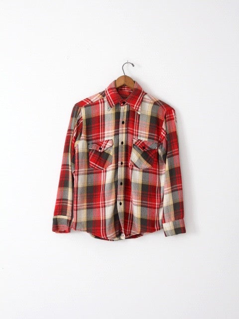 1970s Big Mac Plaid Flannel Shirt Red Gold Black White: 1970s Big Mac Plaid Flannel Shirt Red Gold Black White This vintage 1970s flannel shirt features a classic plaid pattern in red, gold, black, and white. Made from heavy-weight cotton, it showcases a b
