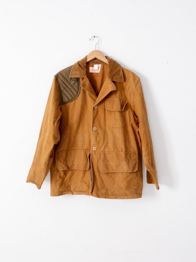 SafTBak Vintage Hunting Jacket Olive Cotton Canvas Size Large: SafTBak Vintage Hunting Jacket Olive Cotton Canvas Size Large This vintage hunting jacket by SafTBak showcases a durable cotton canvas construction, perfect for outdoor enthusiasts. It features three