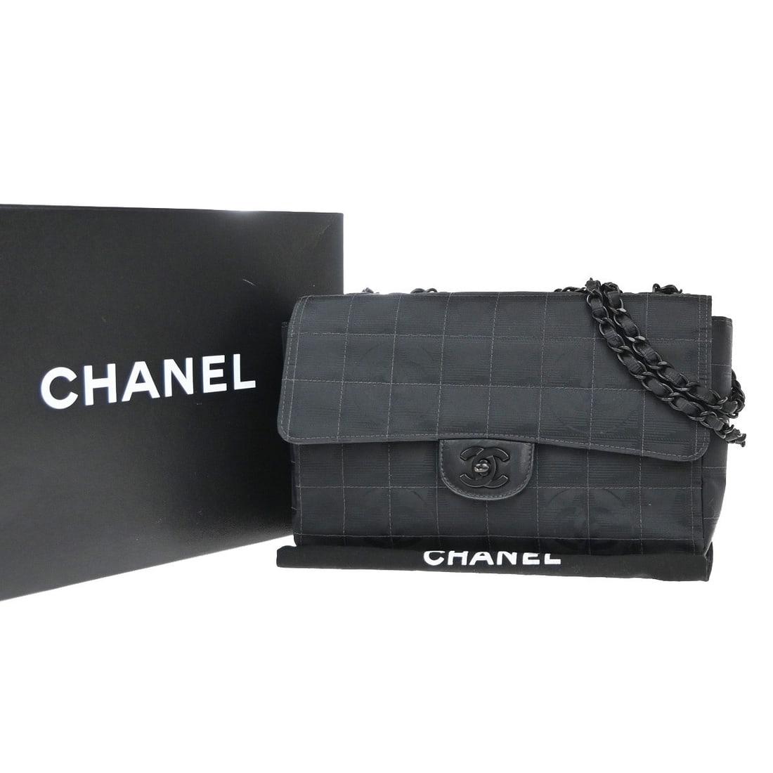 Chanel Nylon Travel Line Flap Handbag Black 25cm: Chanel Nylon Travel Line Flap Handbag Black 25cm This Chanel Travel Line Flap Bag is crafted from black nylon, designed for women. The bag features a flap closure and compact dimensions, making it sui