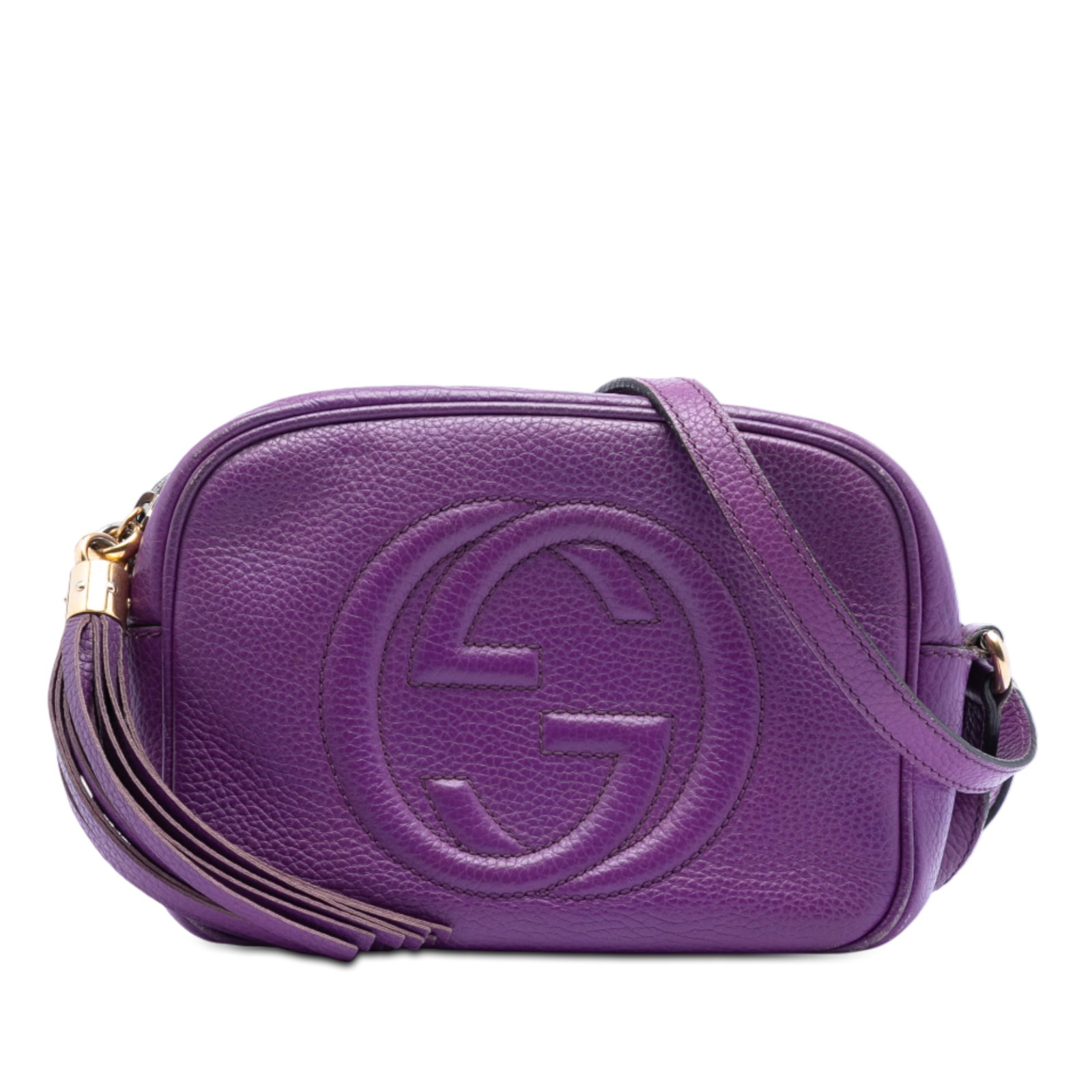 Gucci Soho Disco Purple Leather Crossbody Bag with Tassel: Gucci Soho Disco Purple Leather Crossbody Bag with Tassel This Gucci Soho Disco crossbody bag features a purple leather body with a tassel detail and an adjustable flat leather strap. It is designed w