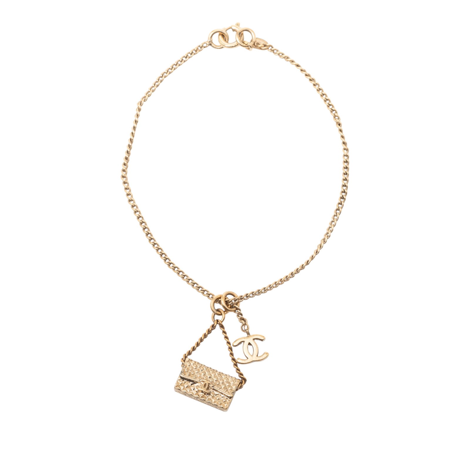 Chanel Flap Bag and CC Pendant Gold Tone Charm Bracelet: Chanel Flap Bag and CC Pendant Gold Tone Charm Bracelet This Chanel bracelet features a gold-tone chain adorned with a flap bag charm and a CC pendant. It is crafted from metal and is secured with a s
