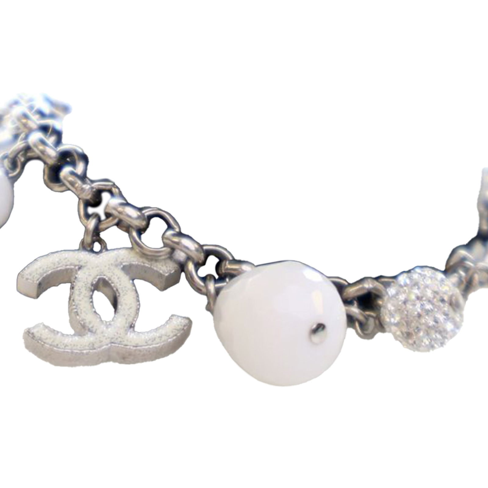 Chanel Crystal and Bead Charm Bracelet with Silver Plated CC Logo: Chanel Crystal and Bead Charm Bracelet with Silver Plated CC Logo This Chanel charm bracelet features a sterling silver chain adorned with crystal and bead charms. The bracelet is finished with a lobs