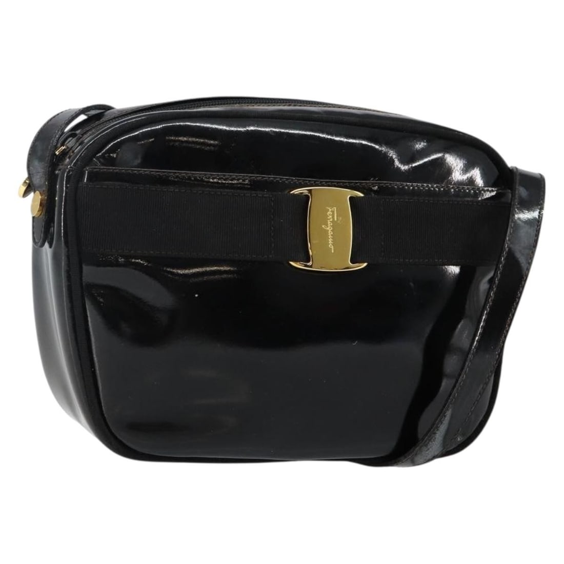 Black Patent Leather Vala Shoulder Bag by Salvatore Ferragamo: Black Patent Leather Vala Shoulder Bag by Salvatore Ferragamo This pre-owned Salvatore Ferragamo Vala shoulder bag for women is crafted from black patent leather. It features a compact design suitable