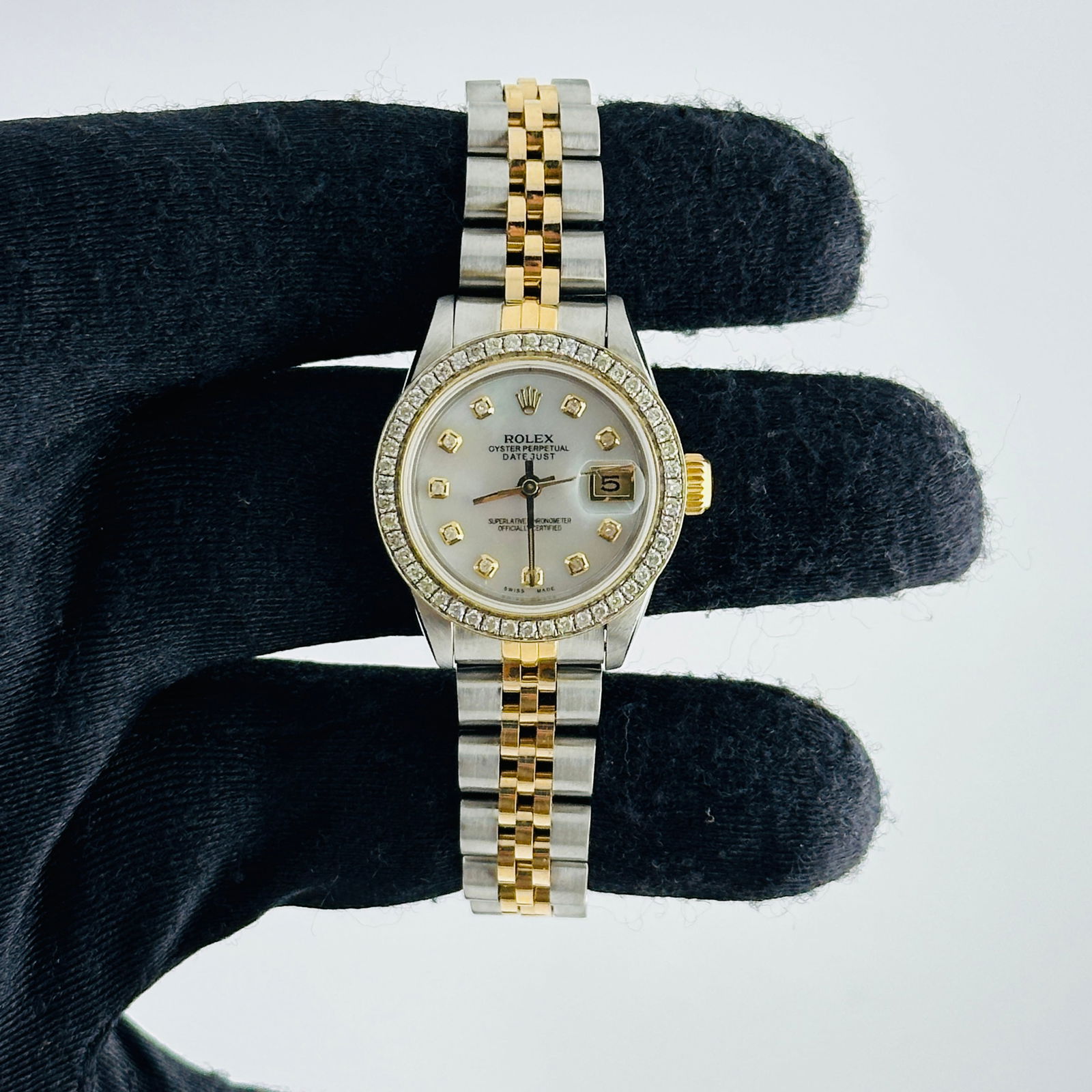 Aftermarket White MOP Diamond Dial Rolex Datejust 69173 D Link Jubilee: Aftermarket White MOP Diamond Dial Rolex Datejust 69173 D Link Jubilee This ladies' Rolex Datejust features an aftermarket white mother-of-pearl diamond dial, complemented by a pave 10K diamond bezel