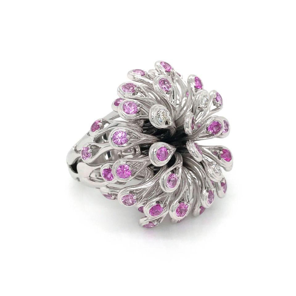 Dior 18K White Gold Diamond Sapphire Fireworks Cocktail Ring: Dior 18K White Gold Diamond Sapphire Fireworks Cocktail Ring This stunning cocktail ring from Dior features a captivating design that embodies the beauty of fireworks. Crafted from 18K white gold, the