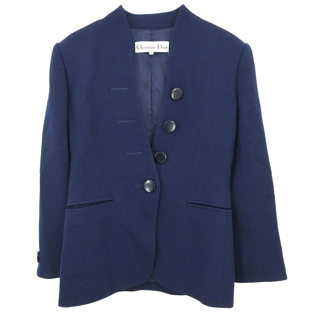 Dior Navy Wool Collarless Mid-Length Jacket Size EU 36: Dior Navy Wool Collarless Mid-Length Jacket Size EU 36 This Christian Dior collarless jacket features a mid-length design crafted from 100% wool. The jacket is styled with long sleeves, button closure
