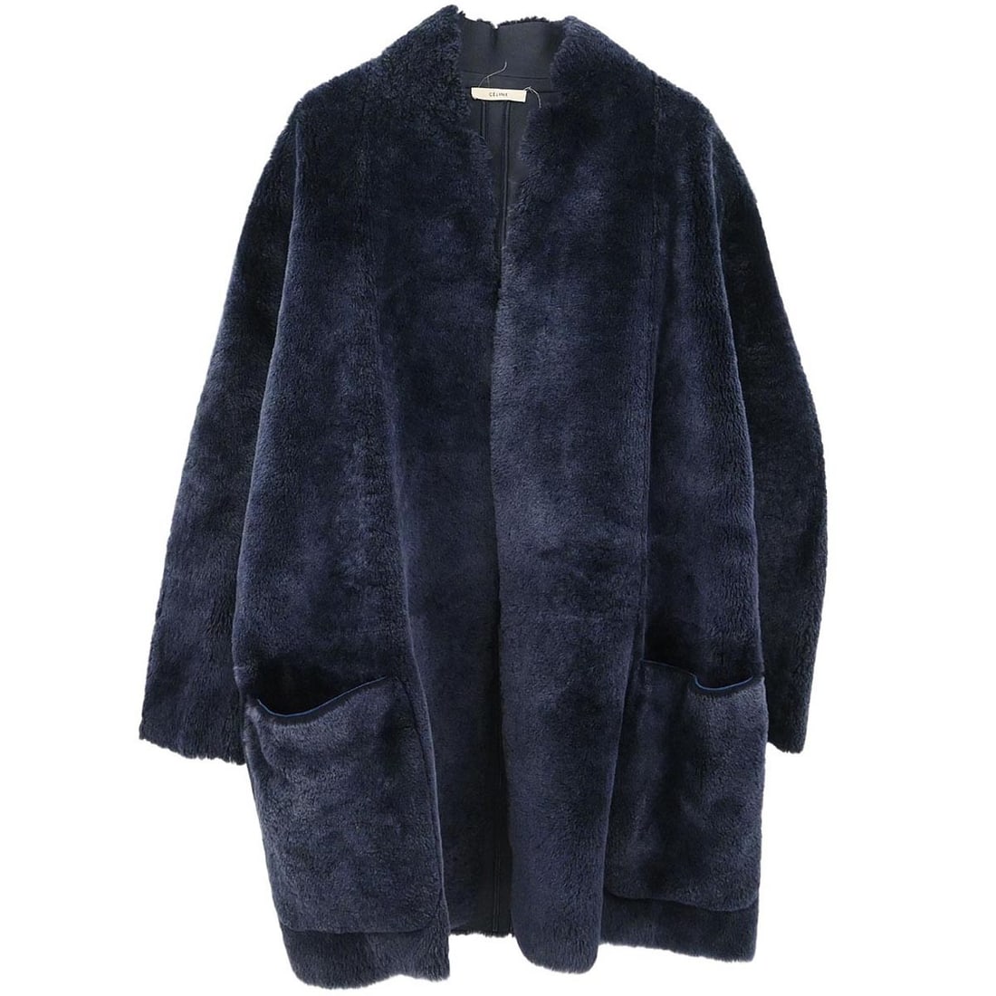 Navy Lambskin Overcoat by Celine Size 38 Vintage Italian: Navy Lambskin Overcoat by Celine Size 38 Vintage Italian This Celine mid-length overcoat is crafted from 100% lambskin leather in a navy hue. Designed with long sleeves, it is ideal for fall and winte
