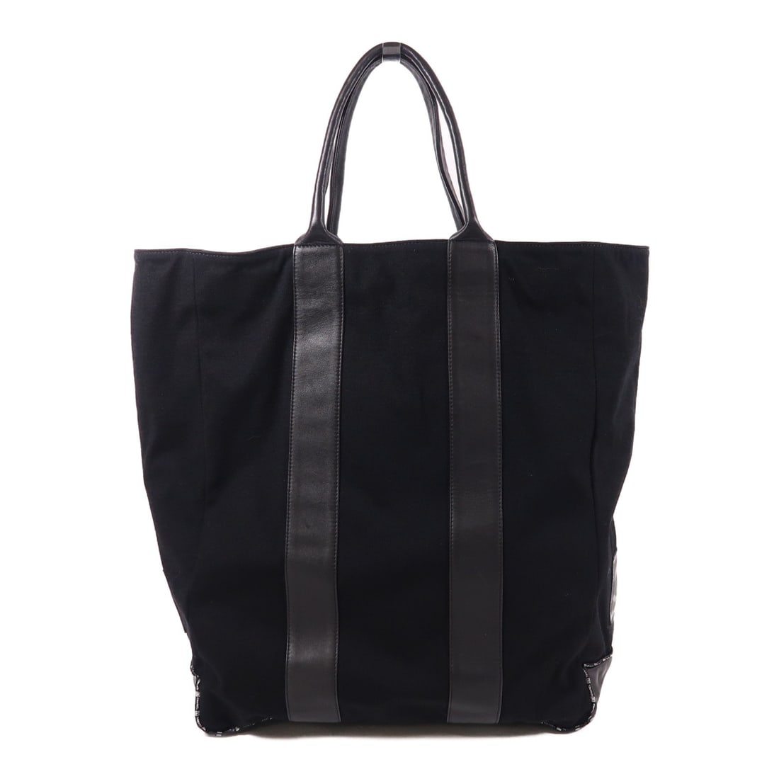 Black Canvas Leather Tote by CHANEL CC Made in France: Black Canvas Leather Tote by CHANEL CC Made in France This exquisite CHANEL CC Tote Bag combines luxury and practicality, crafted from durable black canvas. Its spacious design features a height of 16