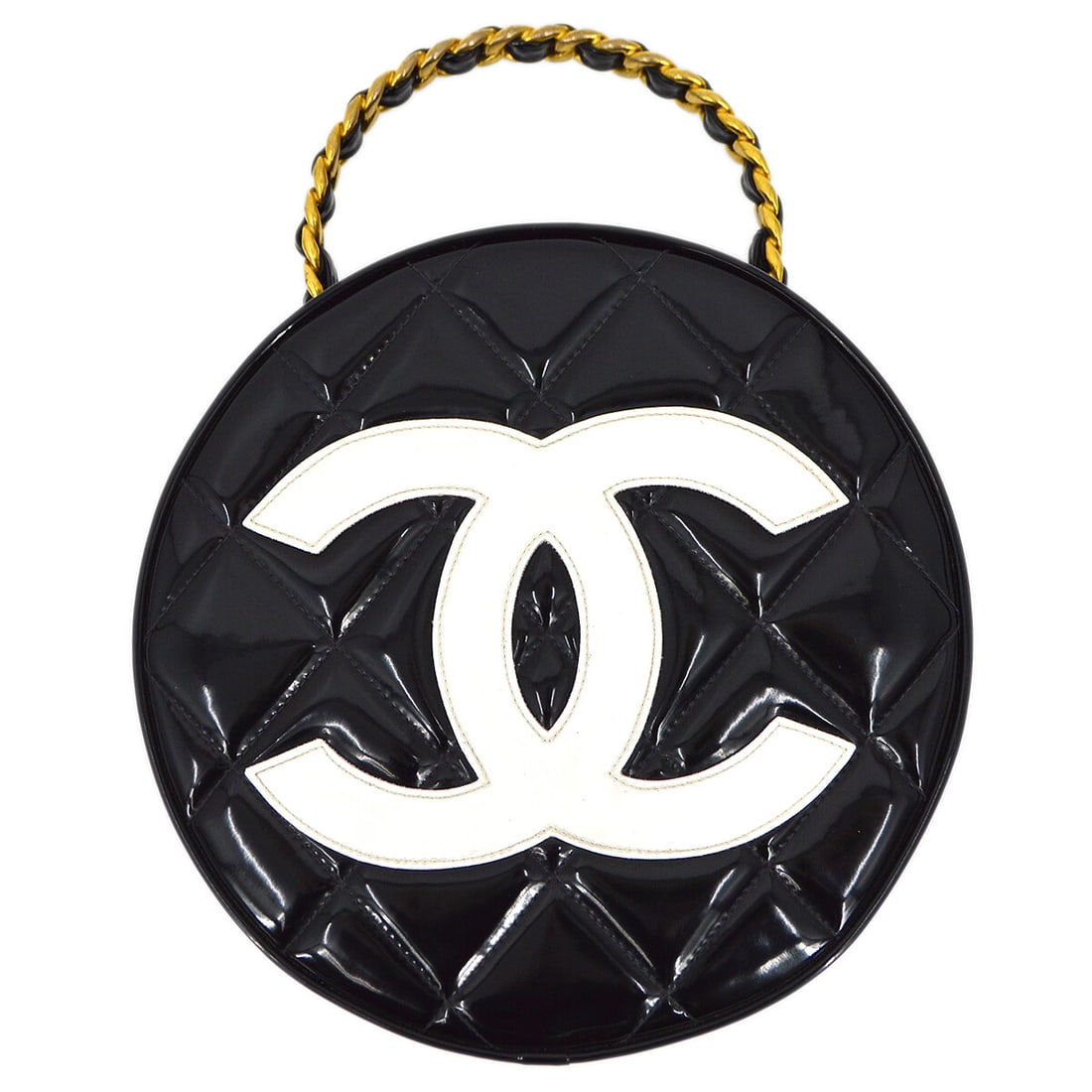 Chanel Quilted Black Patent Leather Round Vanity Top Handle Bag: Chanel Quilted Black Patent Leather Round Vanity Top Handle Bag This Chanel round vanity handbag features black patent leather with a quilted design. It has a medium size, a top handle with a 3-inch d