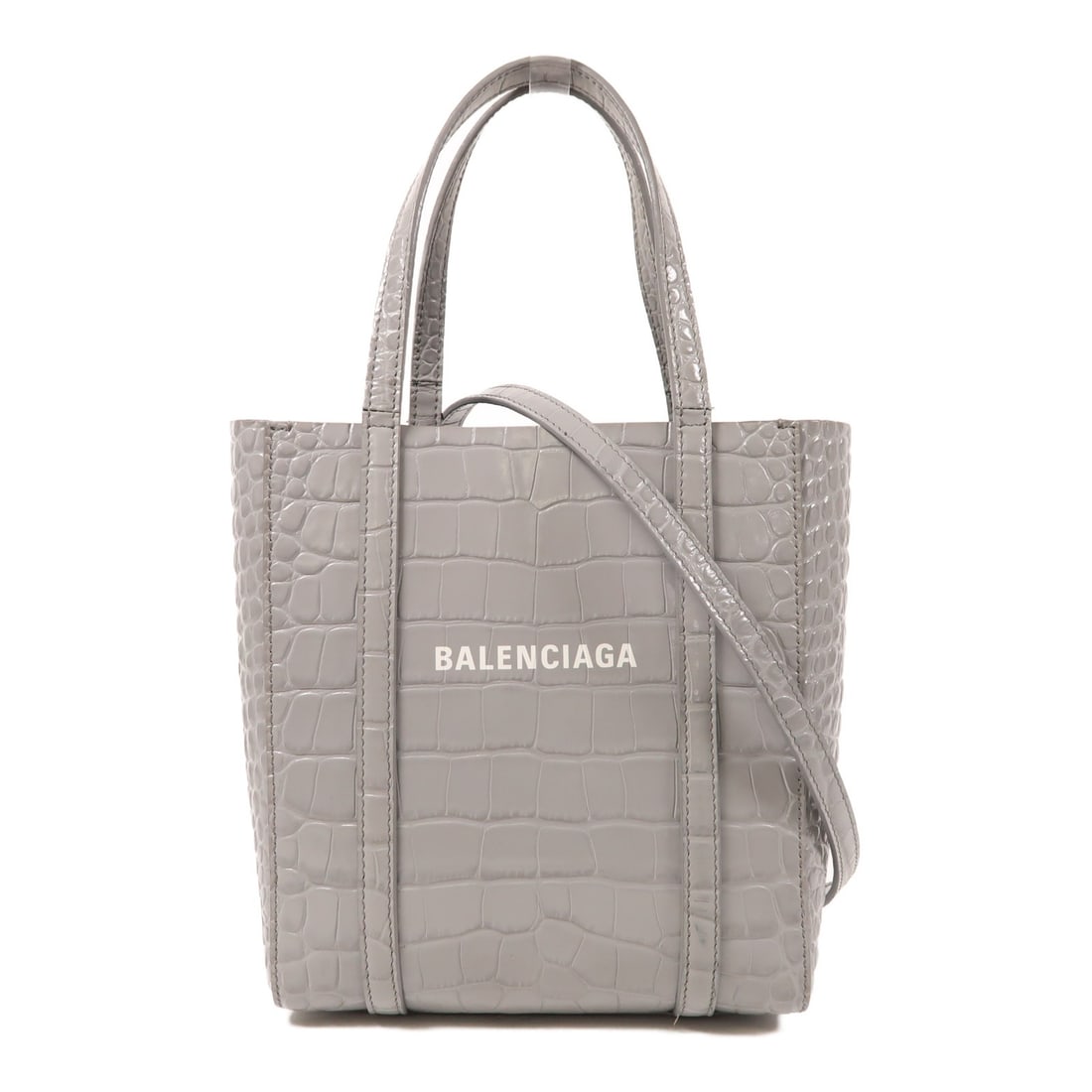 BALENCIAGA Grey Calfskin Leather 2 Way Everyday Tote Shoulder Bag: BALENCIAGA Grey Calfskin Leather 2 Way Everyday Tote Shoulder Bag Discover the elegance of the BALENCIAGA Everyday Tote, a versatile 2-way shoulder bag crafted from luxurious gray calfskin leather. Th