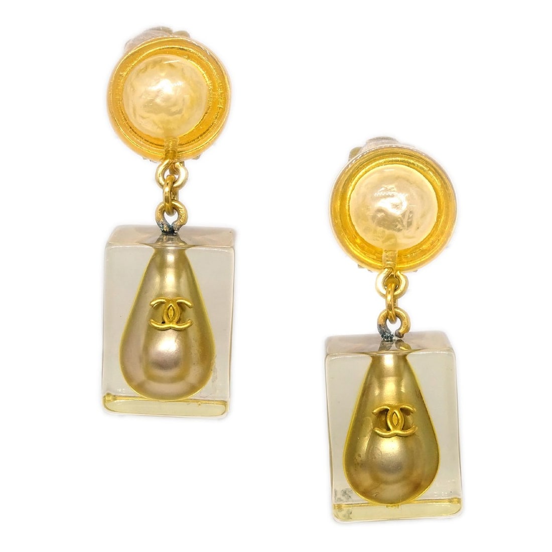 Chanel 97P Gold Clip-On Dangle Earrings with Artificial Pearls: Chanel 97P Gold Clip-On Dangle Earrings with Artificial Pearls Elevate your style with these exquisite Chanel CC Logos Artificial Pearl Dangle Earrings. Crafted with a stunning gold finish, these clip