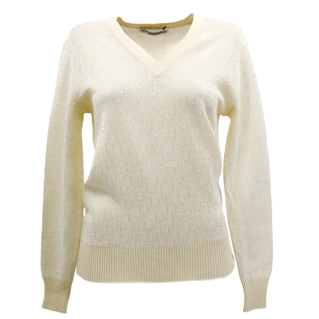 Ivory V-Neck Long Sleeve Sweater by Dior: Ivory V-Neck Long Sleeve Sweater by Dior This Christian Dior ivory sweater features a V-neck design with long sleeves, ideal for casual occasions. It has a regular fit and includes a logo accent for a