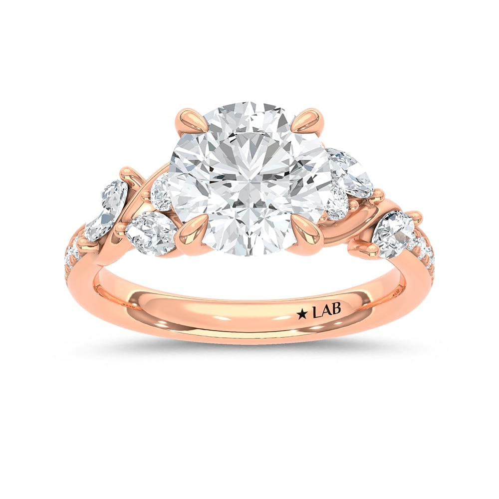 14K Rose Gold Lab Grown Diamond 3 Ct.Tw. Round Shape Engagement Ring (IGI Certified Center 2 1/2ct): 14K Rose Gold Lab Grown Diamond 3 Ct.Tw. Round Shape Engagement Ring (IGI Certified Center 2 1/2ct) Shine brilliantly with this exquisite 14K Rose gold engagement ring, featuring a stunning 3-carat IG