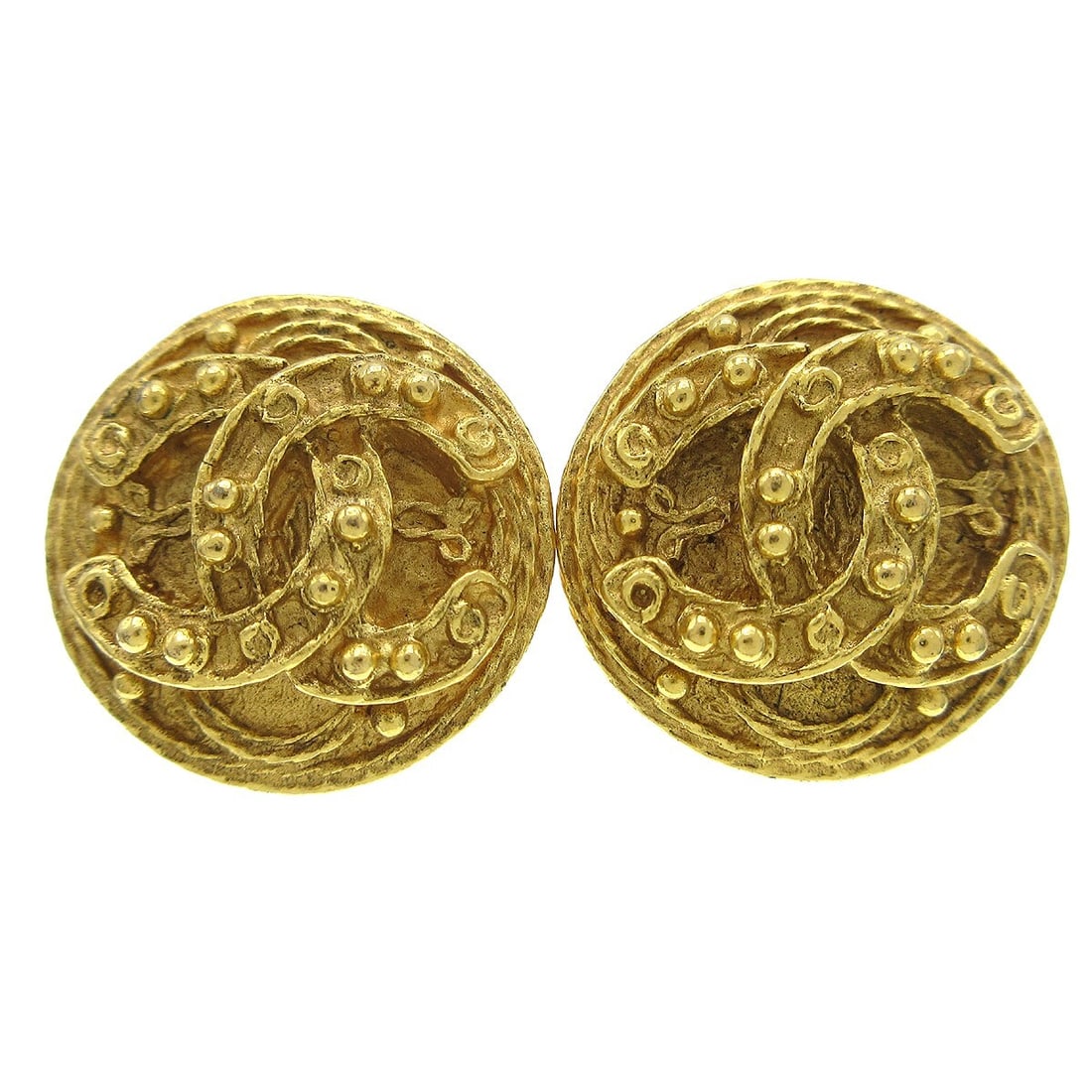 Chanel 94A Gold-Plated Button Clip-On Earrings: Chanel 94A Gold-Plated Button Clip-On Earrings Elevate your accessory collection with these stunning Chanel Button Earrings. Designed in a classic round shape, these clip-on earrings feature a luxurio