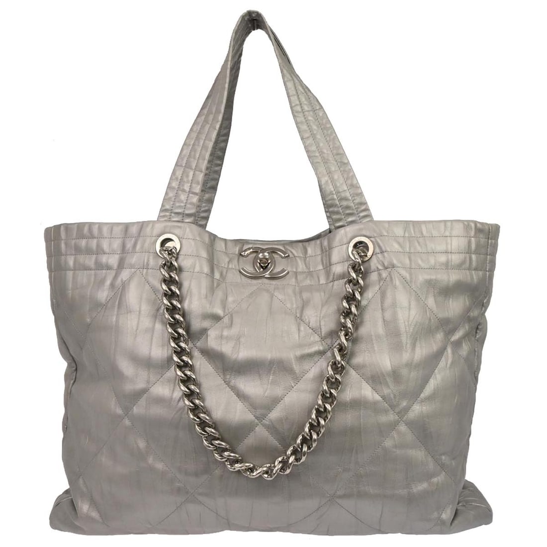 Large Silver Calfskin Tote Ground Control with Logo Accents by Chanel: Large Silver Calfskin Tote Ground Control with Logo Accents by Chanel This Chanel Ground Control tote bag features a silver calfskin exterior with double handles and canvas lining. Designed for casual