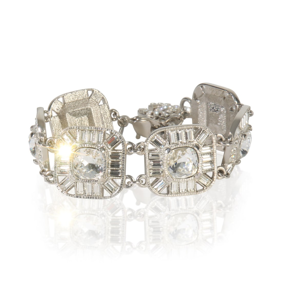 Palladium Plated Bracelet from Chanel 2009 Strass Station Collection with Box: Palladium Plated Bracelet from Chanel 2009 Strass Station Collection with Box This Chanel 2009 Strass Station bracelet is crafted from palladium-plated metal and features a lobster claw clasp. Designe