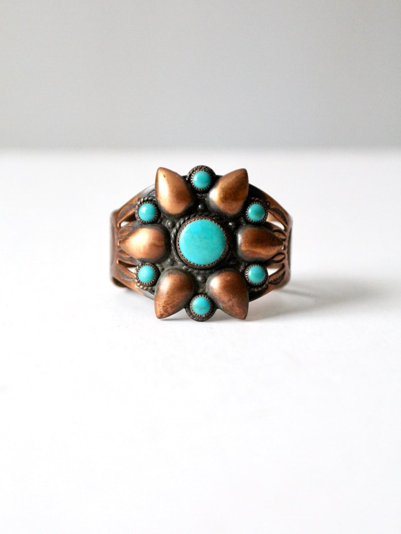 Southwestern Vintage Copper Turquoise Cuff Bracelet: Southwestern Vintage Copper Turquoise Cuff Bracelet This vintage copper and turquoise cuff bracelet features a beautiful southwestern design, highlighted by inset turquoise stones that create a stunni
