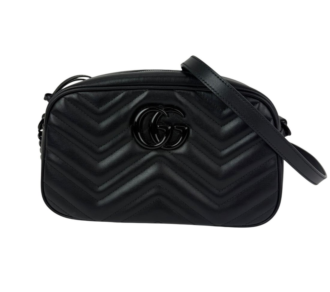 Gucci GG Marmont Small Black Leather Matelasse Camera Crossbody Bag: Gucci GG Marmont Small Black Leather Matelasse Camera Crossbody Bag The Gucci GG Marmont Small Camera Monochrome Crossbody Bag features a crescent silhouette crafted from black matelasse leather with