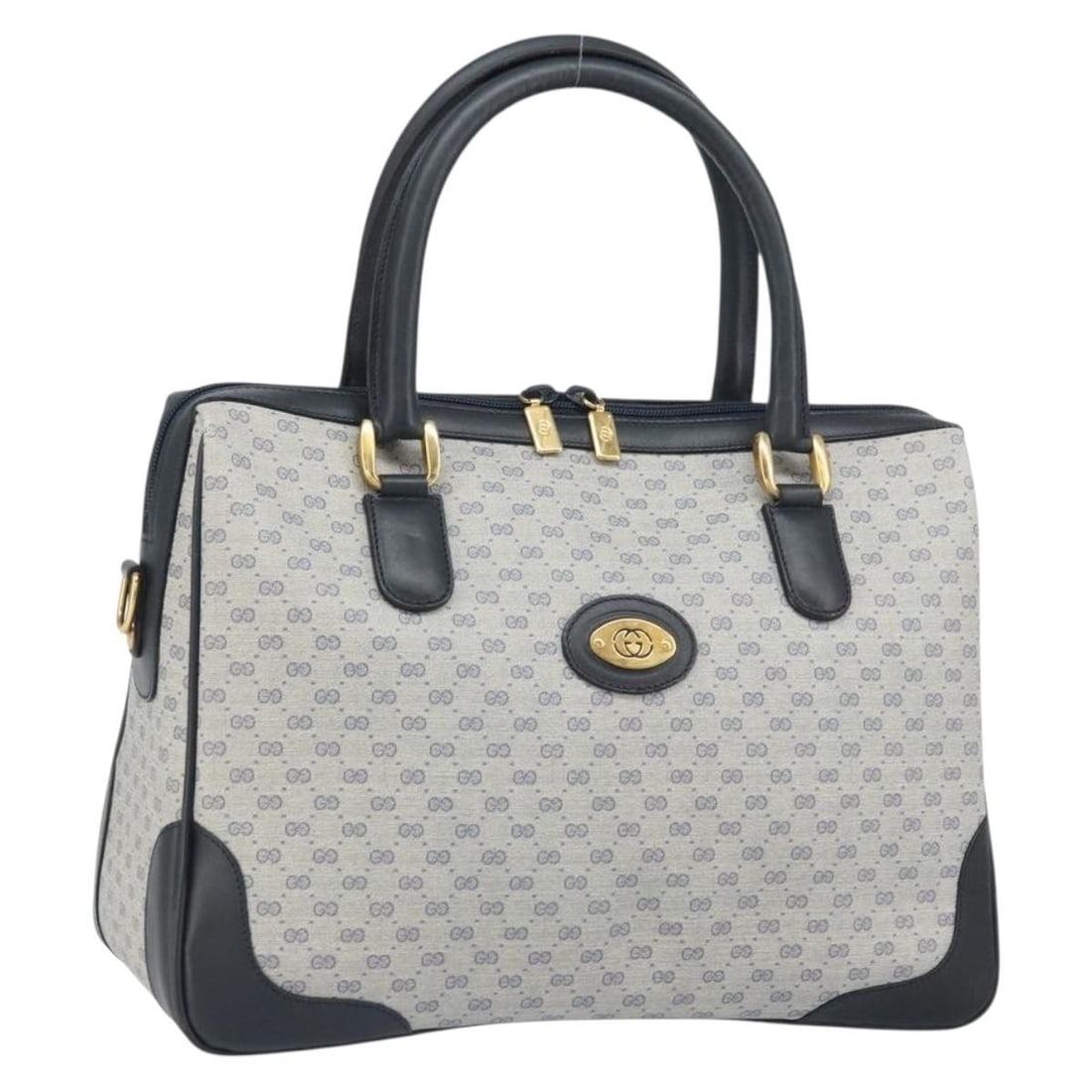 Navy Micro GG Supreme PVC Handbag by Gucci Model 002 58 0033: Navy Micro GG Supreme PVC Handbag by Gucci Model 002 58 0033 This Gucci Micro GG Supreme hand bag features a navy and gold color scheme with PVC leather and micro small GG canvas exterior. The bag is