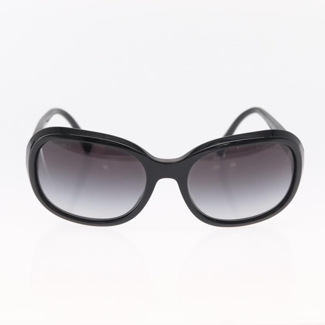 Chanel Black Plastic CC Logo Women's Sunglasses: Chanel Black Plastic CC Logo Women's Sunglasses These Chanel Logo CC sunglasses are crafted from black plastic and designed for women. The sunglasses feature the iconic Chanel logo and offer a stylish