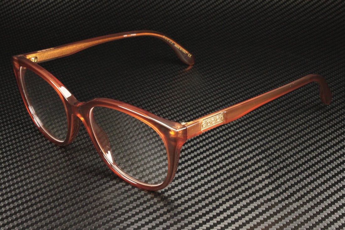 GUCCI GG0791O 002 Brown Oval Women's Eyeglasses with Authenticity Certificate: GUCCI GG0791O 002 Brown Oval Women's Eyeglasses with Authenticity Certificate Discover the elegance of these GUCCI GG0791O 002 eyeglasses, designed specifically for women. Featuring a stylish oval sha