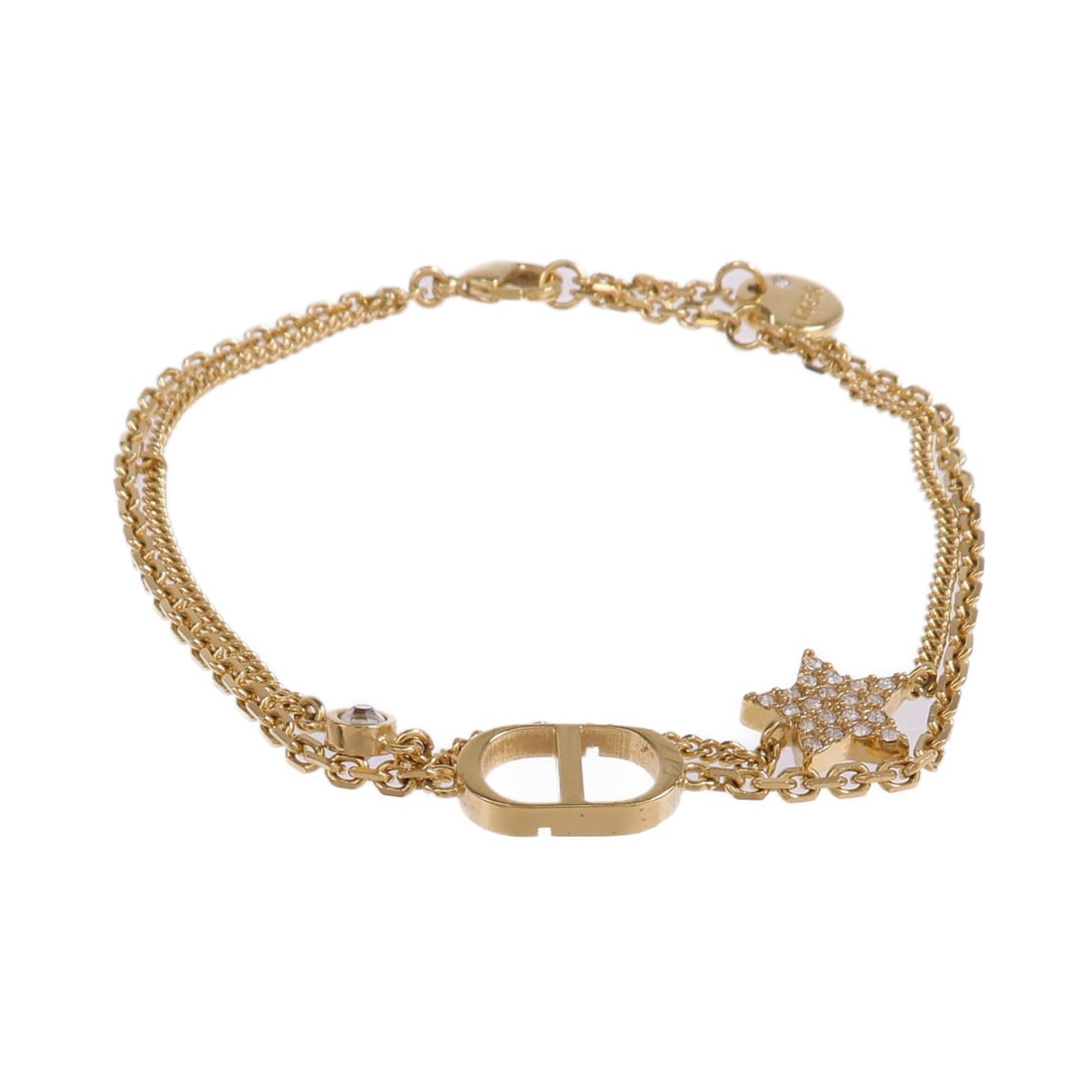 Dior Gold Tone Metal Bracelet with CD Motif: Dior Gold Tone Metal Bracelet with CD Motif This Christian Dior bracelet features a gold-toned metal finish and an elegant design. Crafted in France, it does not include any stones and is sized as reg