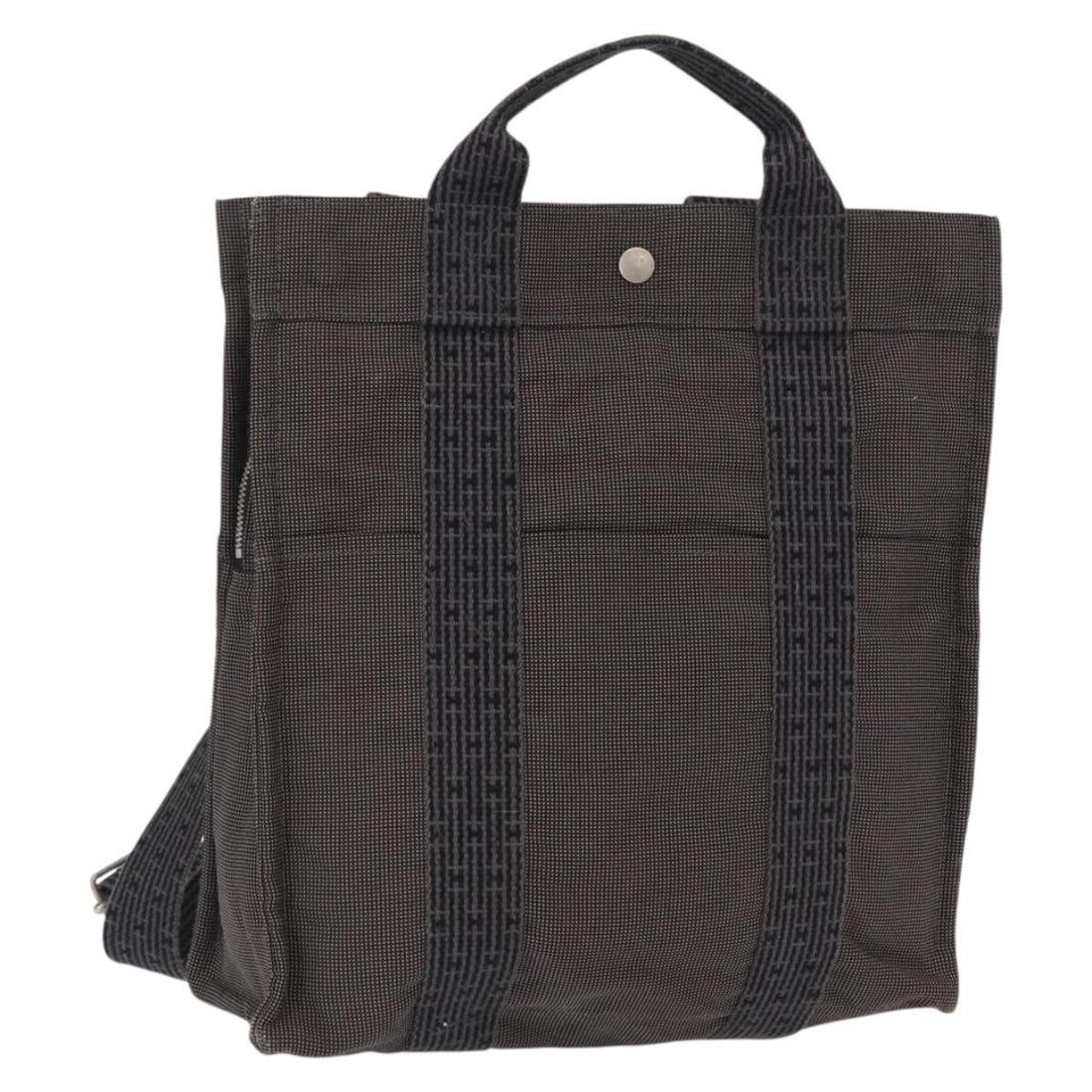 Hermes Her Line A Dos MM Canvas Gray Silver Backpack France: Hermes Her Line A Dos MM Canvas Gray Silver Backpack France This is an authentic Hermes Her Line A Dos MM backpack crafted from gray and silver canvas. The bag features a spacious main compartment and