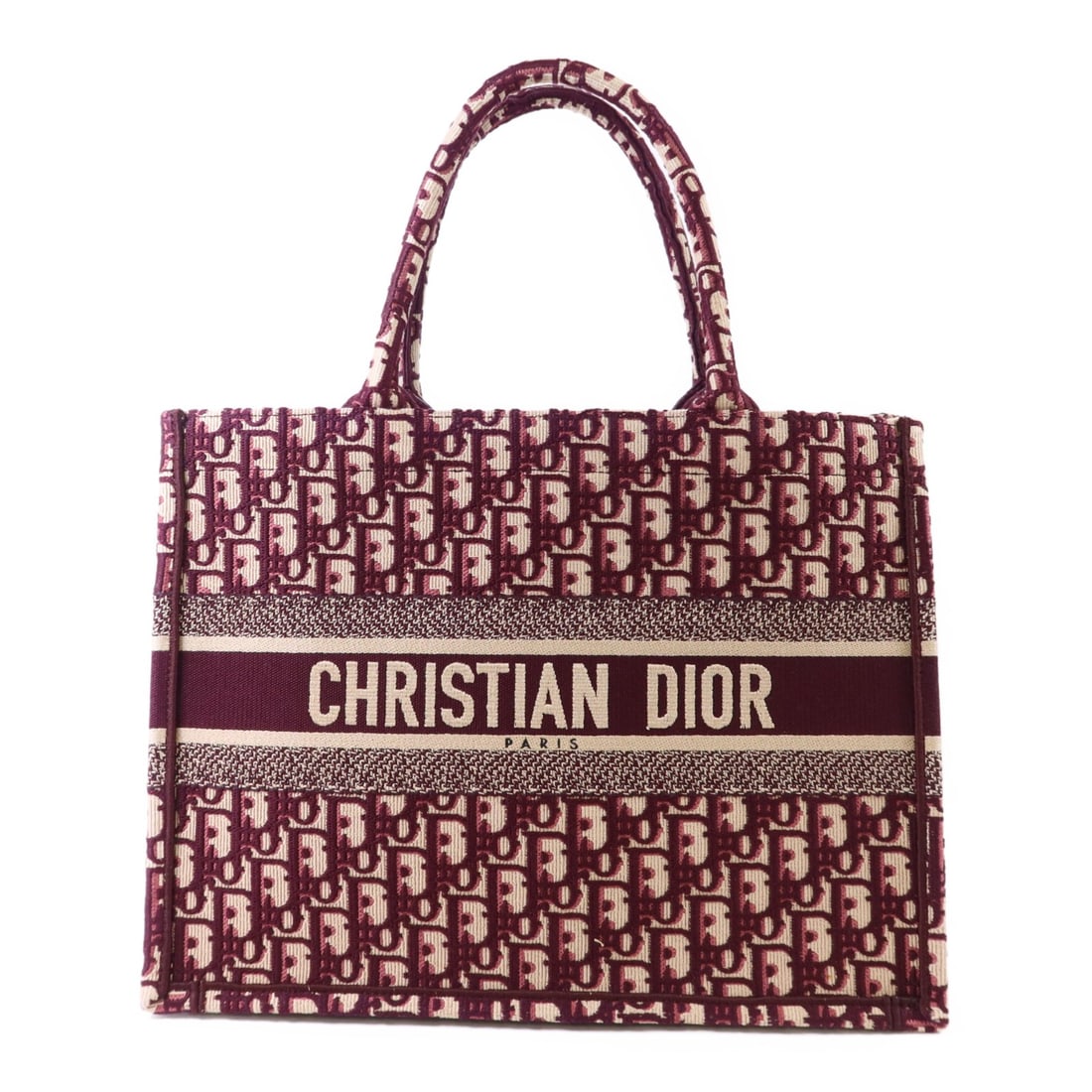 Dior Book Tote Canvas Bag in Red and Beige M1286: Dior Book Tote Canvas Bag in Red and Beige M1286 This Christian Dior Book Tote is crafted from red canvas with beige accents. Made in France, it features a spacious interior and a classic tote design,