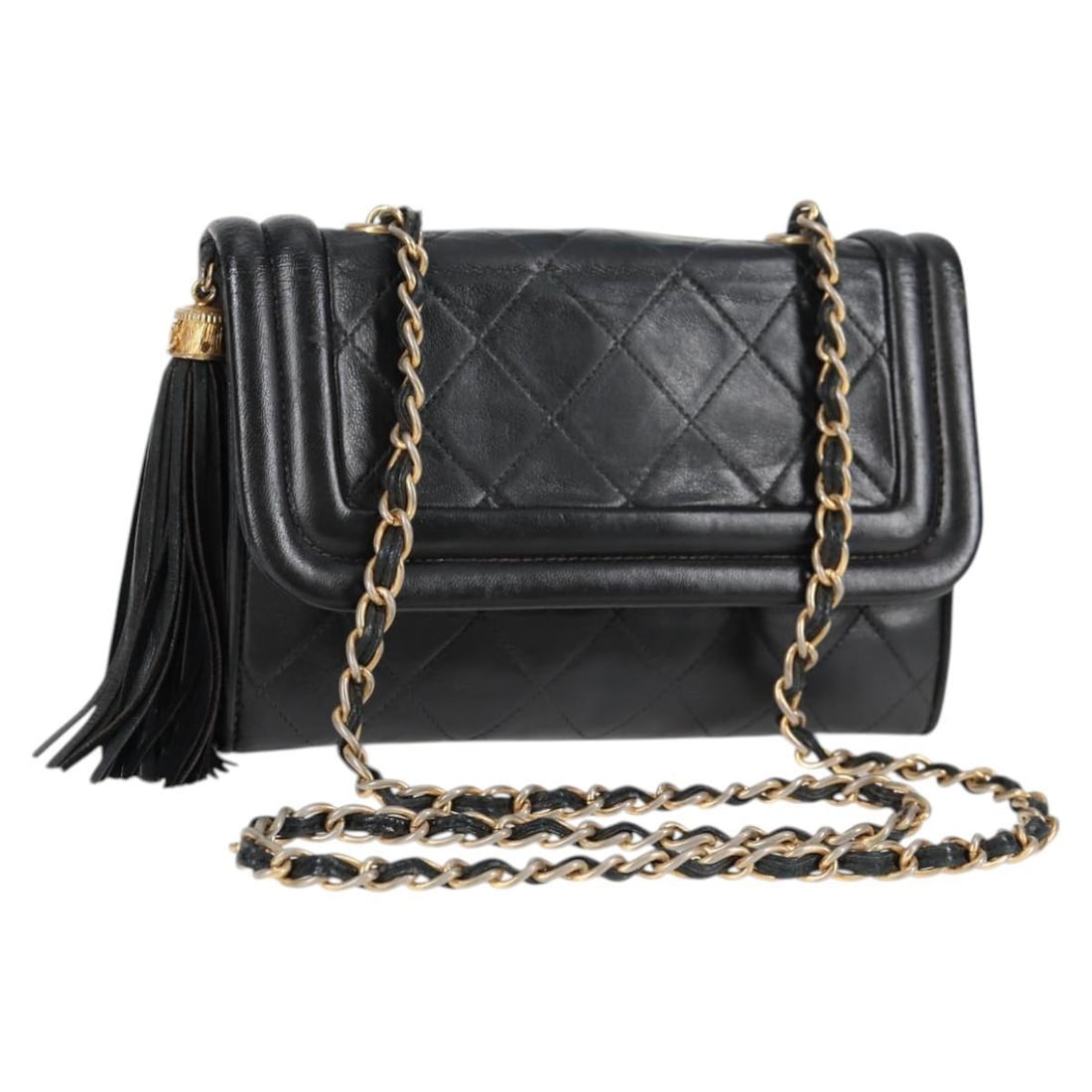 Chanel Leather Vintage Tassel Flap Shoulder Bag Black: Chanel Leather Vintage Tassel Flap Shoulder Bag Black This Chanel Vintage Tassel Flap Bag for women features black leather construction with a tassel detail. It presents signs of wear including rubbin