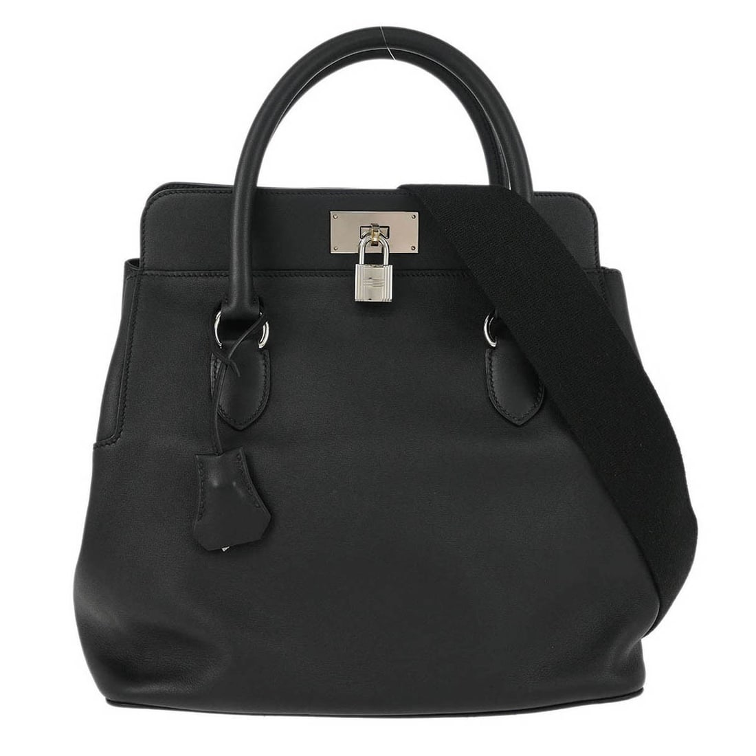 Black Leather Hermes Toolbox Handbag 26cm by 29cm by 18cm: Black Leather Hermes Toolbox Handbag 26cm by 29cm by 18cm This Hermes Toolbox Bag for women features black leather construction with a structured silhouette. It includes a shoulder strap and metal fit