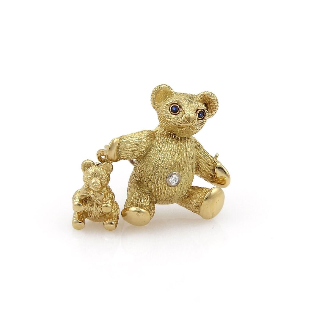 18k Gold Mother Bear and Cub Brooch with Diamonds and Sapphires by Tiffany & Co.: 18k Gold Mother Bear and Cub Brooch with Diamonds and Sapphires by Tiffany & Co. This vintage Tiffany & Co. brooch is crafted from 18k yellow gold and features a charming design of a mother bear and h
