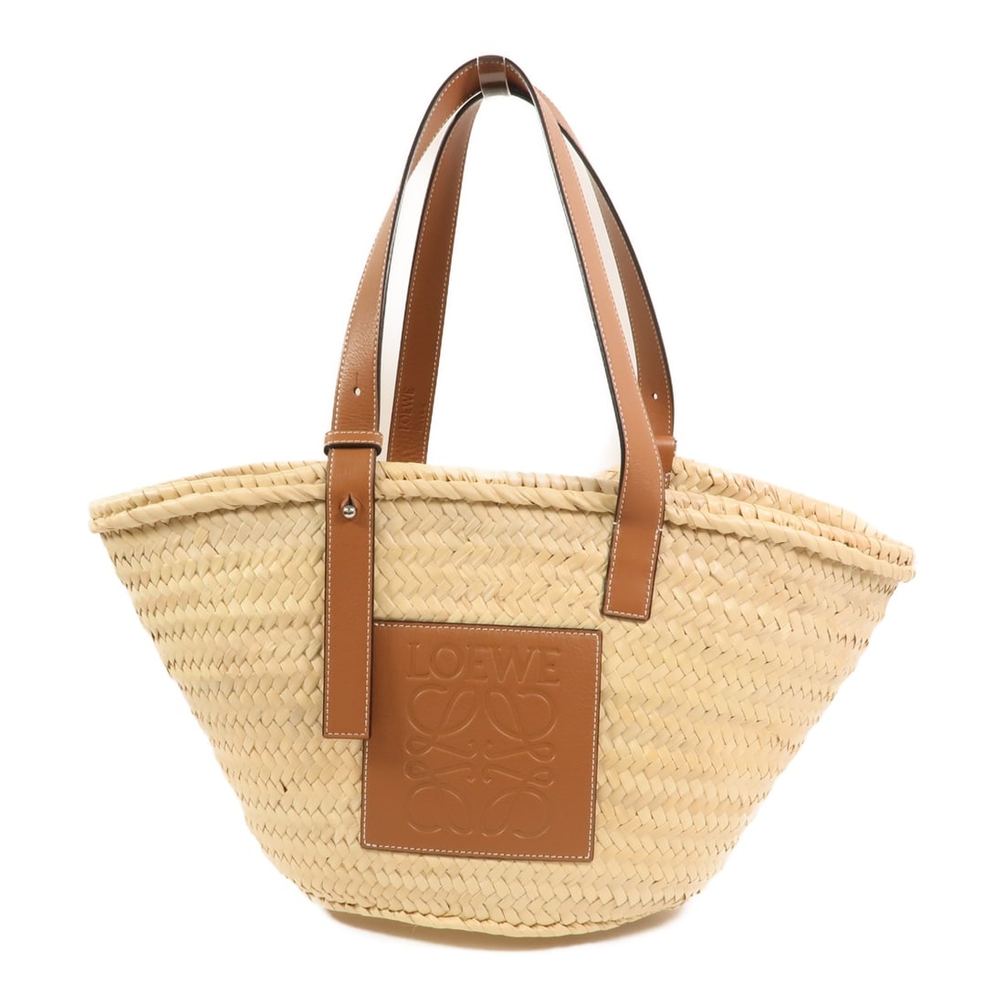 Raffia Brown Tote Bag LOEWE Silver Hardware: Raffia Brown Tote Bag LOEWE Silver Hardware This LOEWE bucket tote bag features a brown raffia exterior, offering a relaxed yet stylish look. Designed as a regular size tote, it provides ample space f