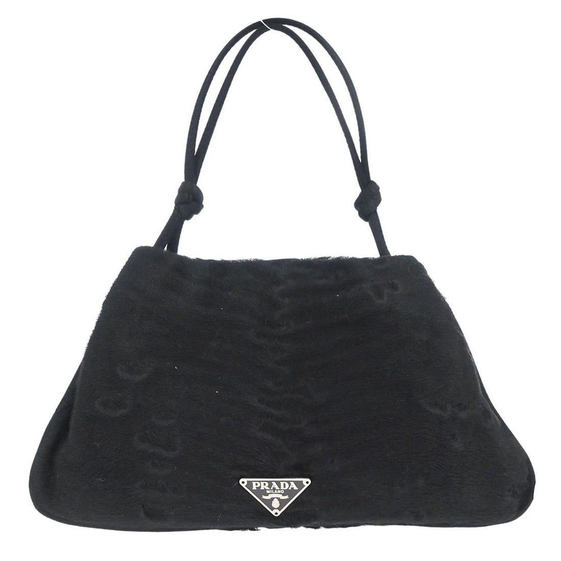 Small Prada Top Handle Bag in Black Nylon with Logo Accent: Small Prada Top Handle Bag in Black Nylon with Logo Accent This Prada top handle bag features a black pony hair exterior with nylon material and signature logo accents. Designed in a small size, it is