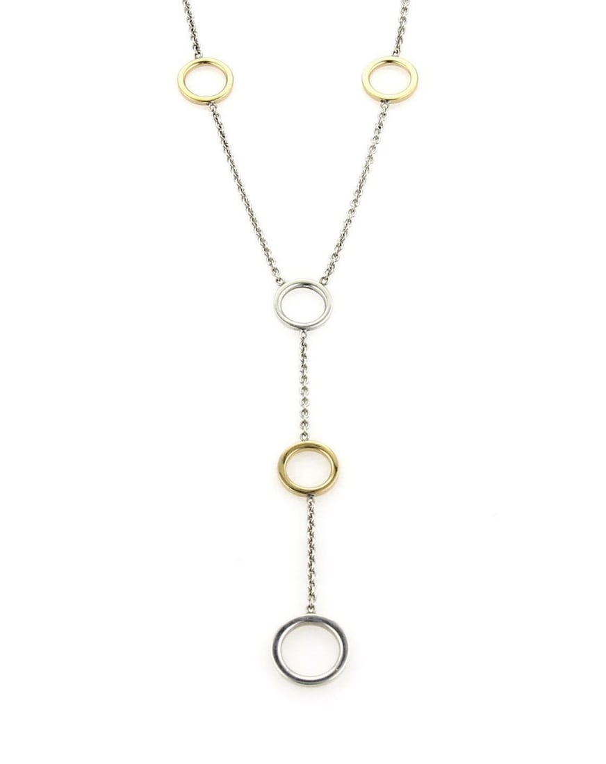 Tiffany & Co. 18k Yellow Gold Sterling Silver Lariat Necklace: Tiffany & Co. 18k Yellow Gold Sterling Silver Lariat Necklace This exquisite Tiffany & Co. necklace showcases a sophisticated lariat design, expertly crafted from solid 18k yellow gold and sterling si