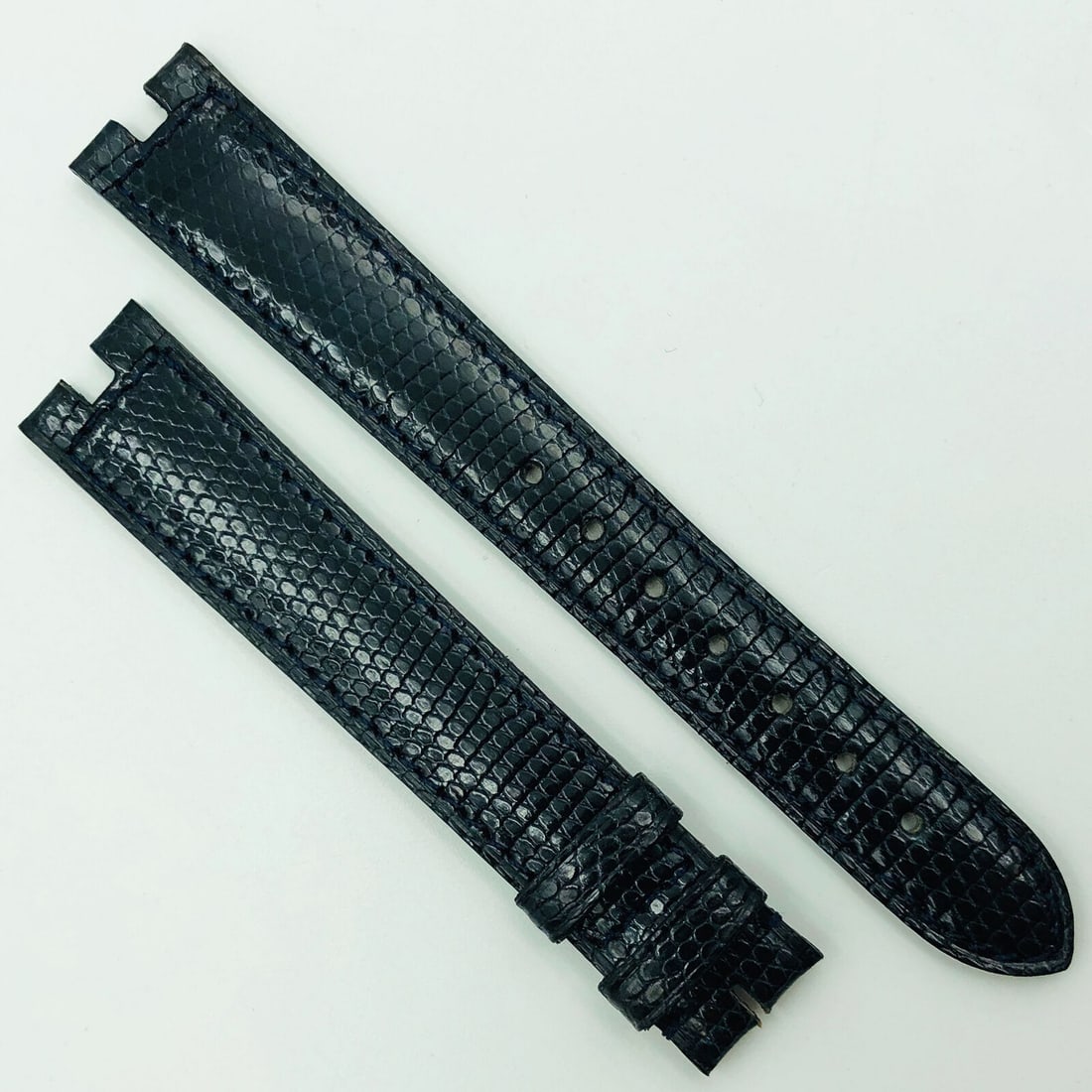 Cartier 16mm Black Leather Two-Piece Strap Buckle 5806H10ODAD: Cartier 16mm Black Leather Two-Piece Strap Buckle 5806H10ODAD Enhance your Cartier watch with this authentic 16mm black shiny leather strap designed for buckle attachment. This two-piece strap showcas