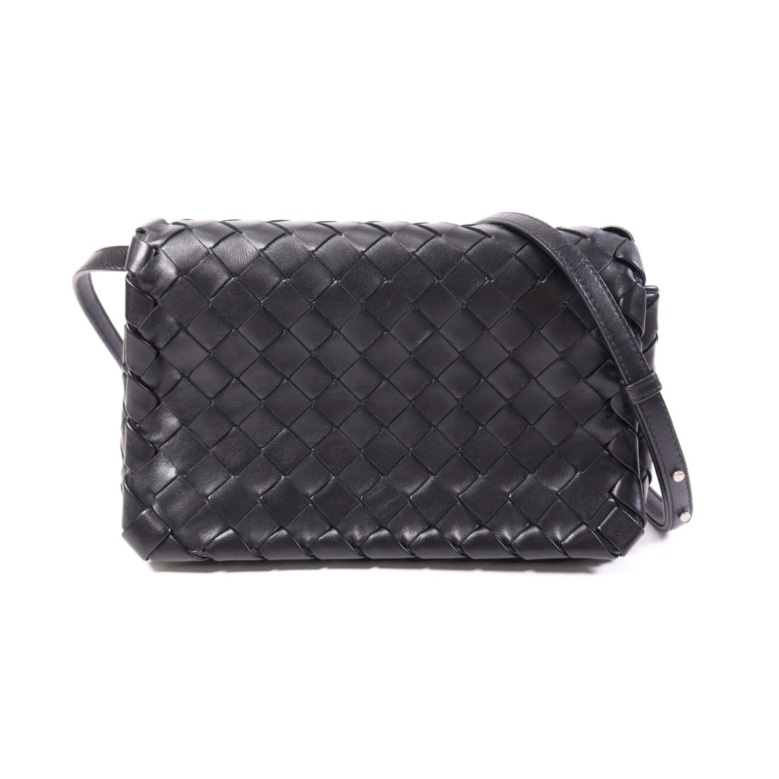 Calfskin Leather Shoulder Bag by Bottega Veneta in Black with SHW: Calfskin Leather Shoulder Bag by Bottega Veneta in Black with SHW This Bottega Veneta shoulder bag is crafted from black calfskin leather and features a sleek, compact design. Made in Italy, the bag i