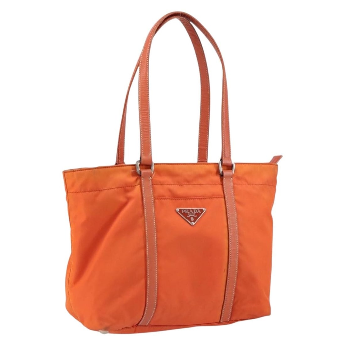 PRADA Orange Silver Nylon Tote Bag Italy Auth GH1423: PRADA Orange Silver Nylon Tote Bag Italy Auth GH1423 This stylish Prada tote bag is crafted from durable nylon in an eye-catching orange and silver color combination. With ample space for your essenti