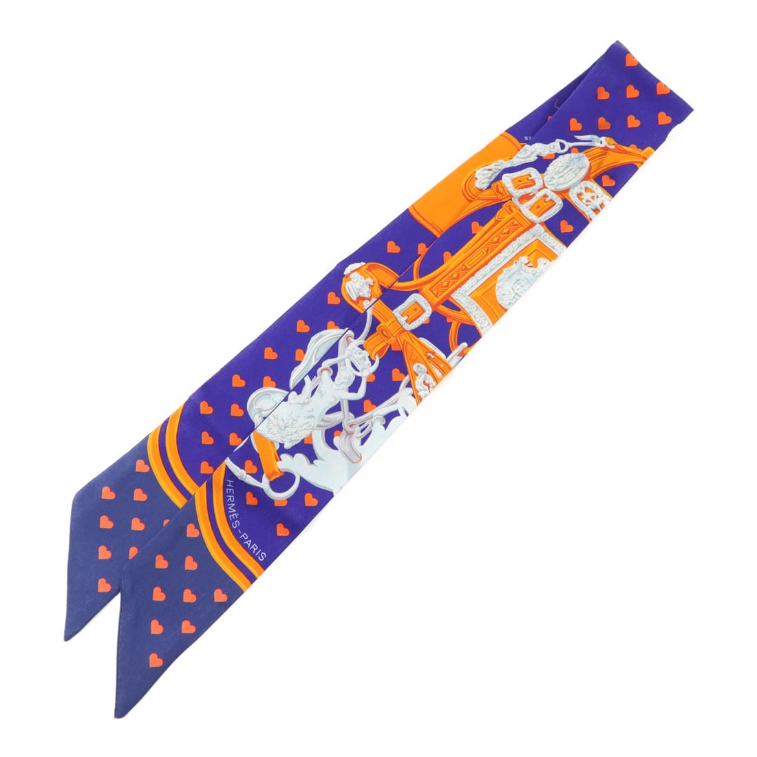 Silk Twilly Scarf by Hermes in Blue and Orange: Silk Twilly Scarf by Hermes in Blue and Orange Hermes Twilly scarf crafted from silk in blue and orange tones. This accessory features a regular size and showcases the brand's renowned craftsmanship.