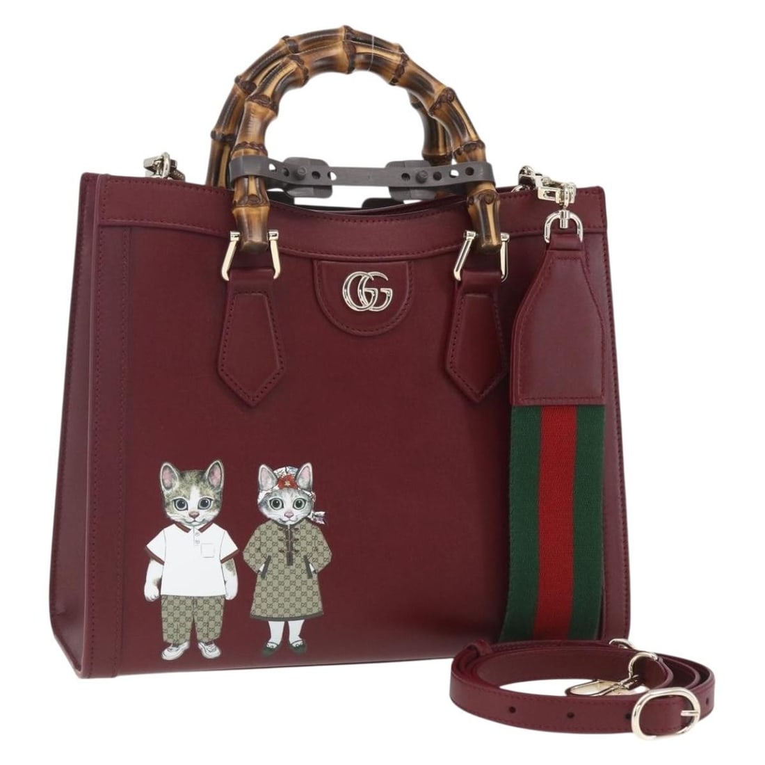 Gucci Diana Bamboo Yuko Higuchi Bordeaux Leather Bag with Strap and Dust Bag: Gucci Diana Bamboo Yuko Higuchi Bordeaux Leather Bag with Strap and Dust Bag This is a Gucci Bamboo Diana Yuko Higuchi 2-way handbag crafted from bordeaux leather with gold-tone accents. The bag featu