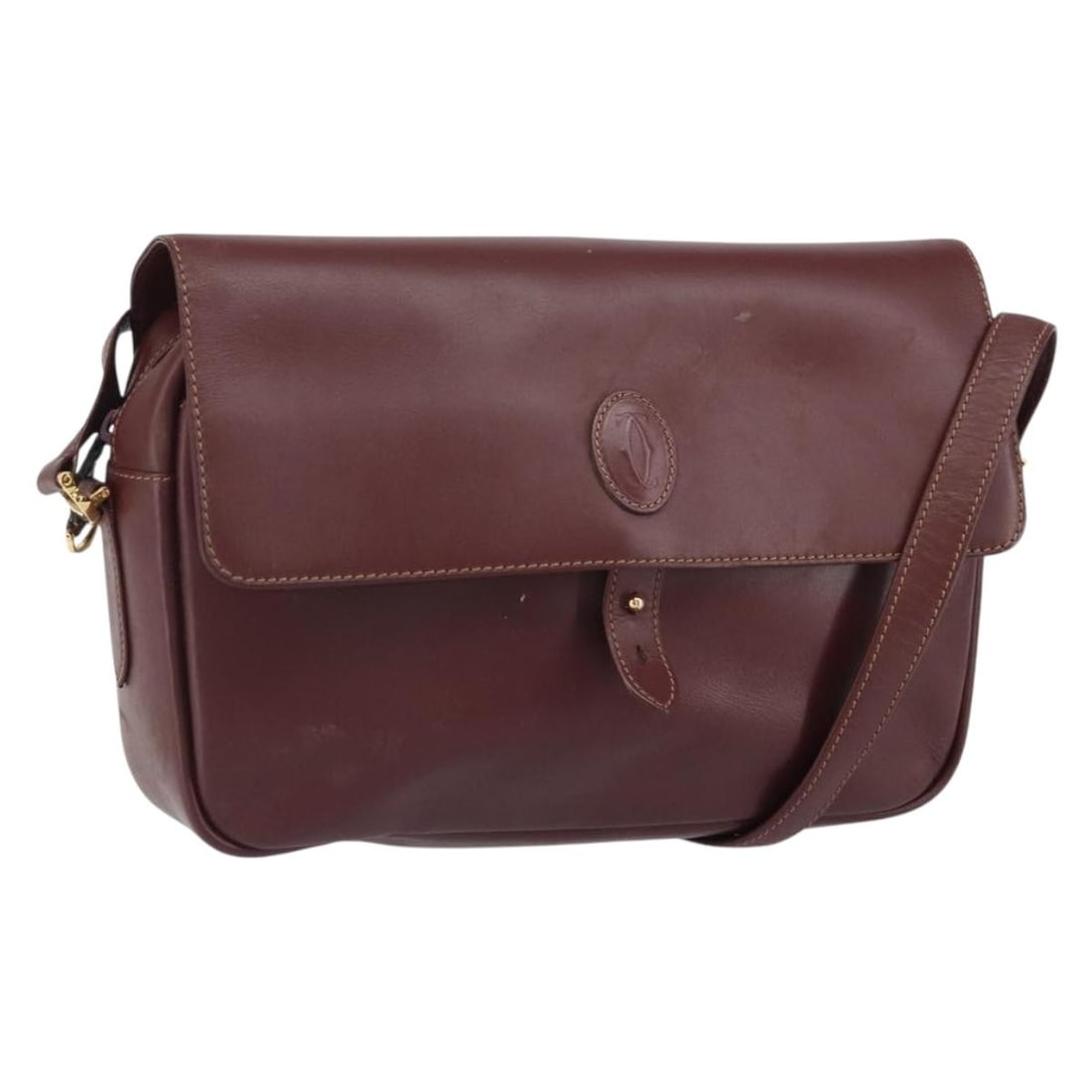 Leather Bordeaux Cartier Must Line Shoulder Bag with Gold Tone Hardware: Leather Bordeaux Cartier Must Line Shoulder Bag with Gold Tone Hardware This Cartier Must Line shoulder bag features a Bordeaux leather exterior with gold-tone hardware. Designed for everyday use, it